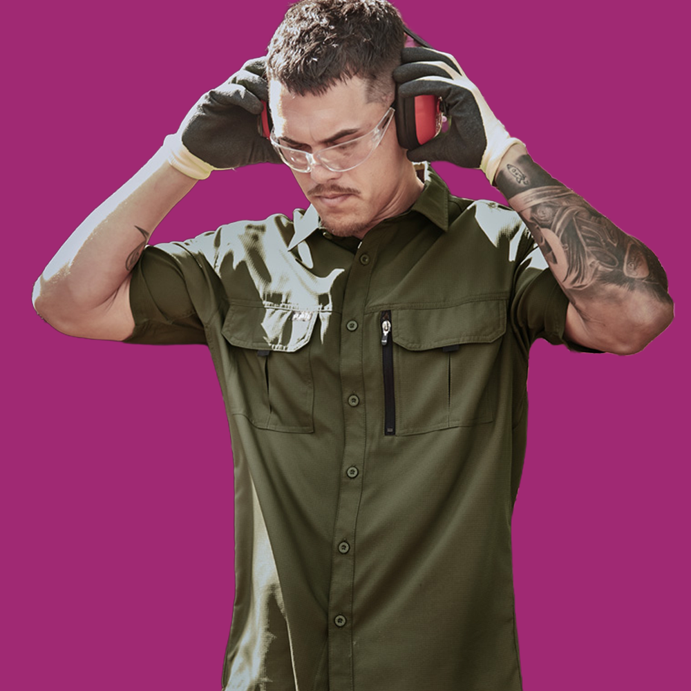 A Man Wearing a UPF 50+ Long Sleeve Shirt with the Sleeves Rolled up From SunSafe Australia