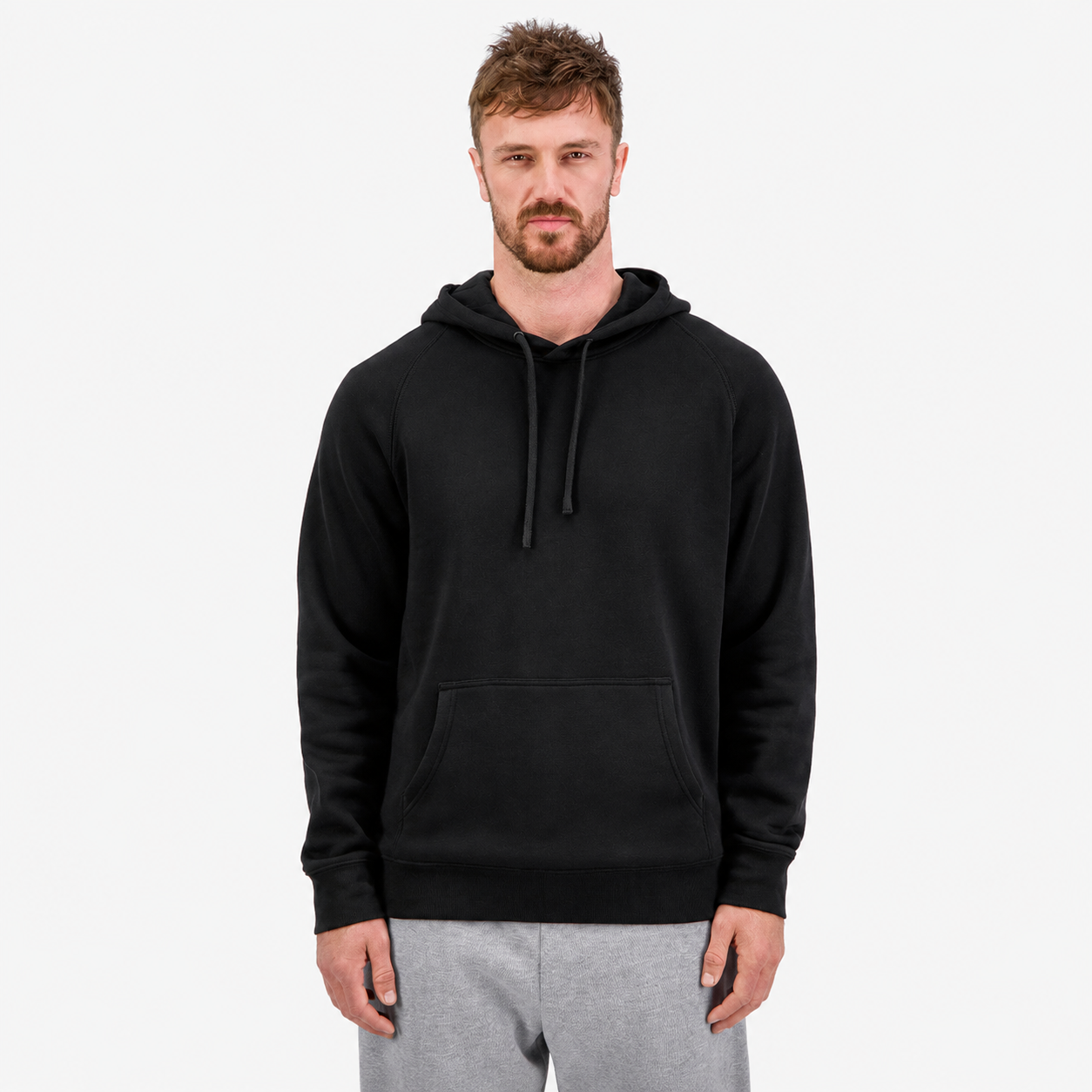 Men's Basis Hoodie in Black, featuring a classic raglan fit, 290 GSM brushed fleece fabric, ribbed cuffs and waistband, adjustable hood with drawcord, and a front kangaroo pocket.